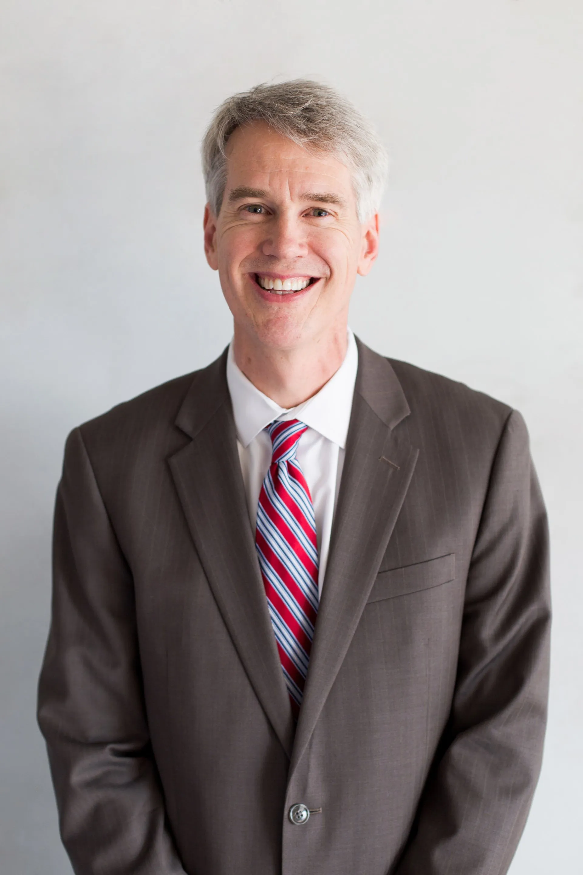 Chris York, smiling in professional attire